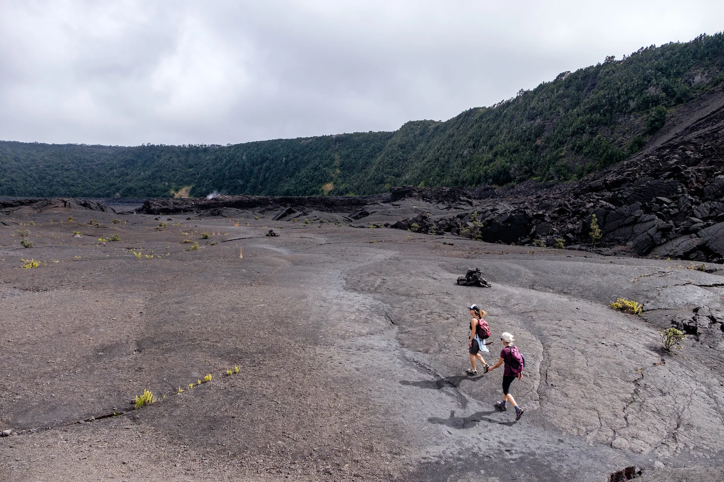 Hikers crossing the crater at Kīlauea Iki.