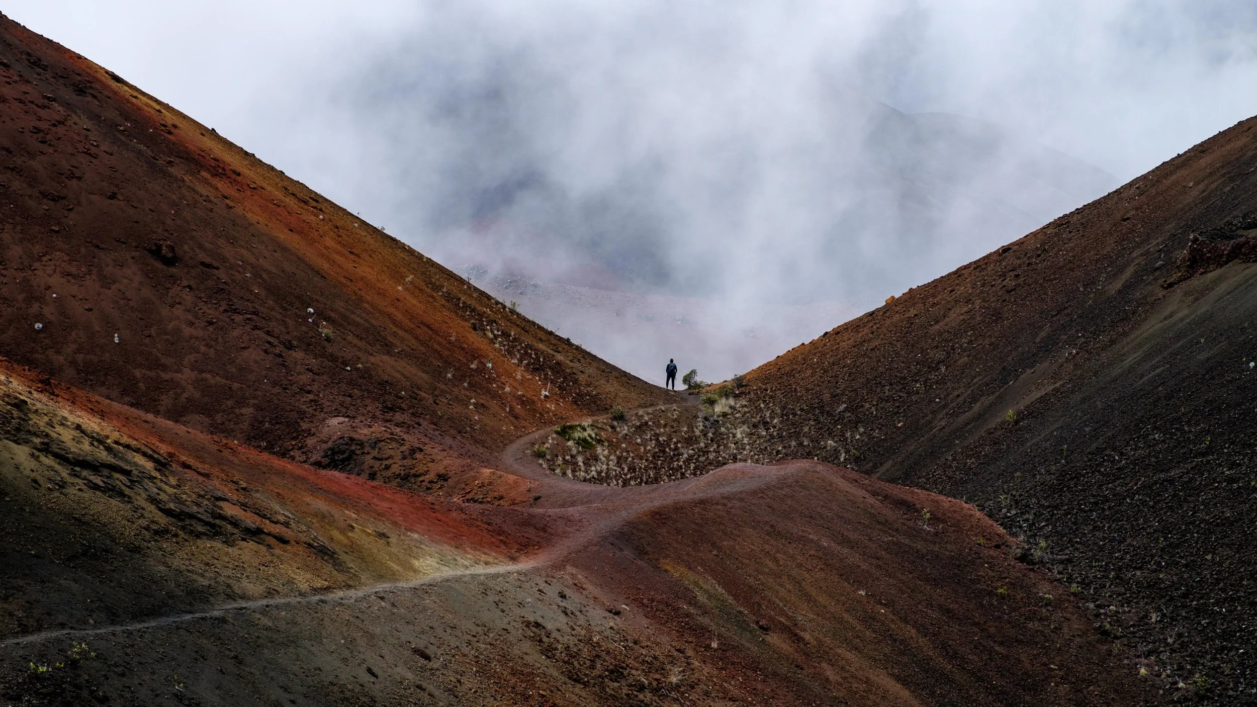 Surreal terrain washed with rich color on the cinder-cone landscape of the Haleakala Crater.