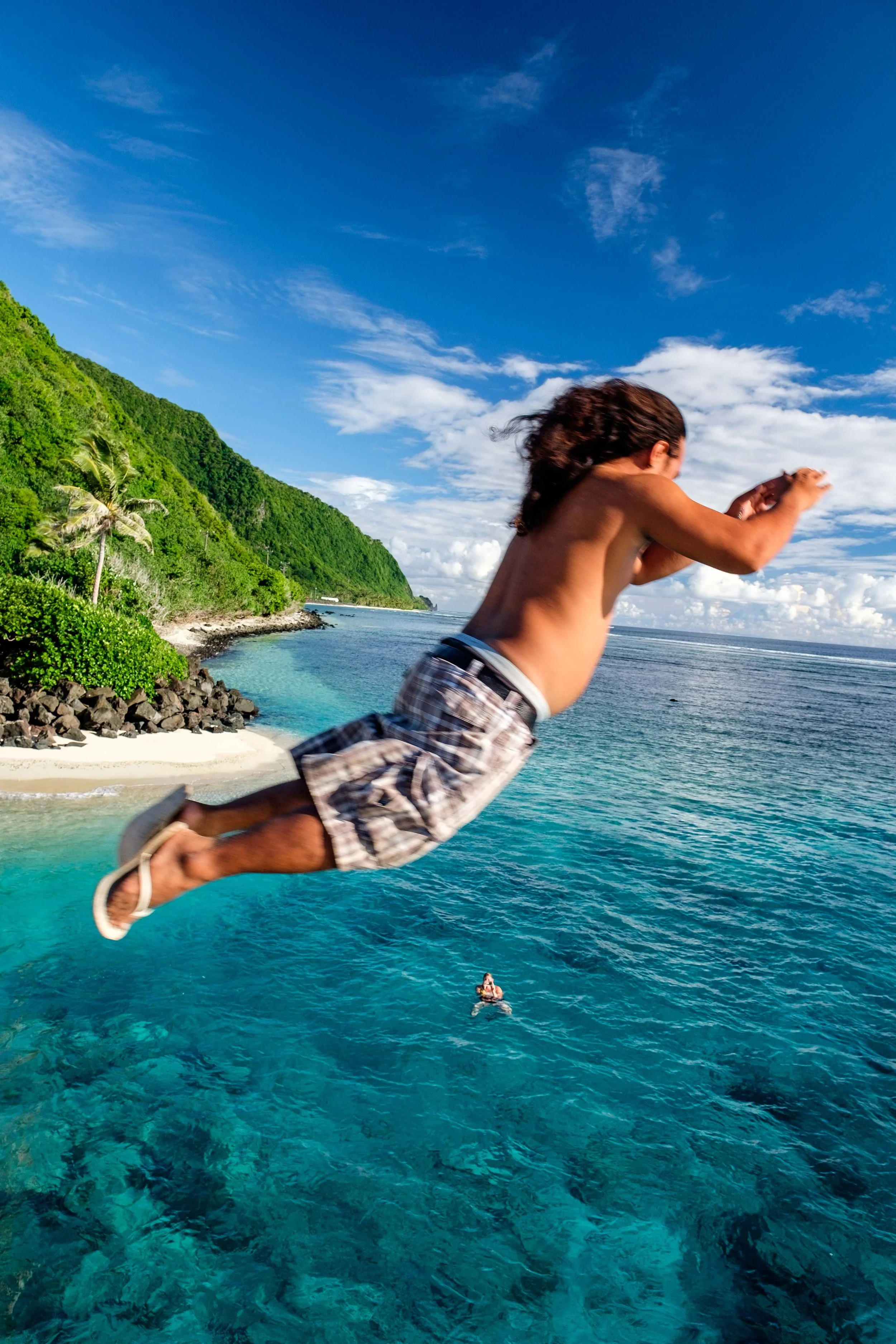 Bridge jumping with the National Park Service Rangers between the islands of Ofu and Olesega in the Manu'a Islands chain. 