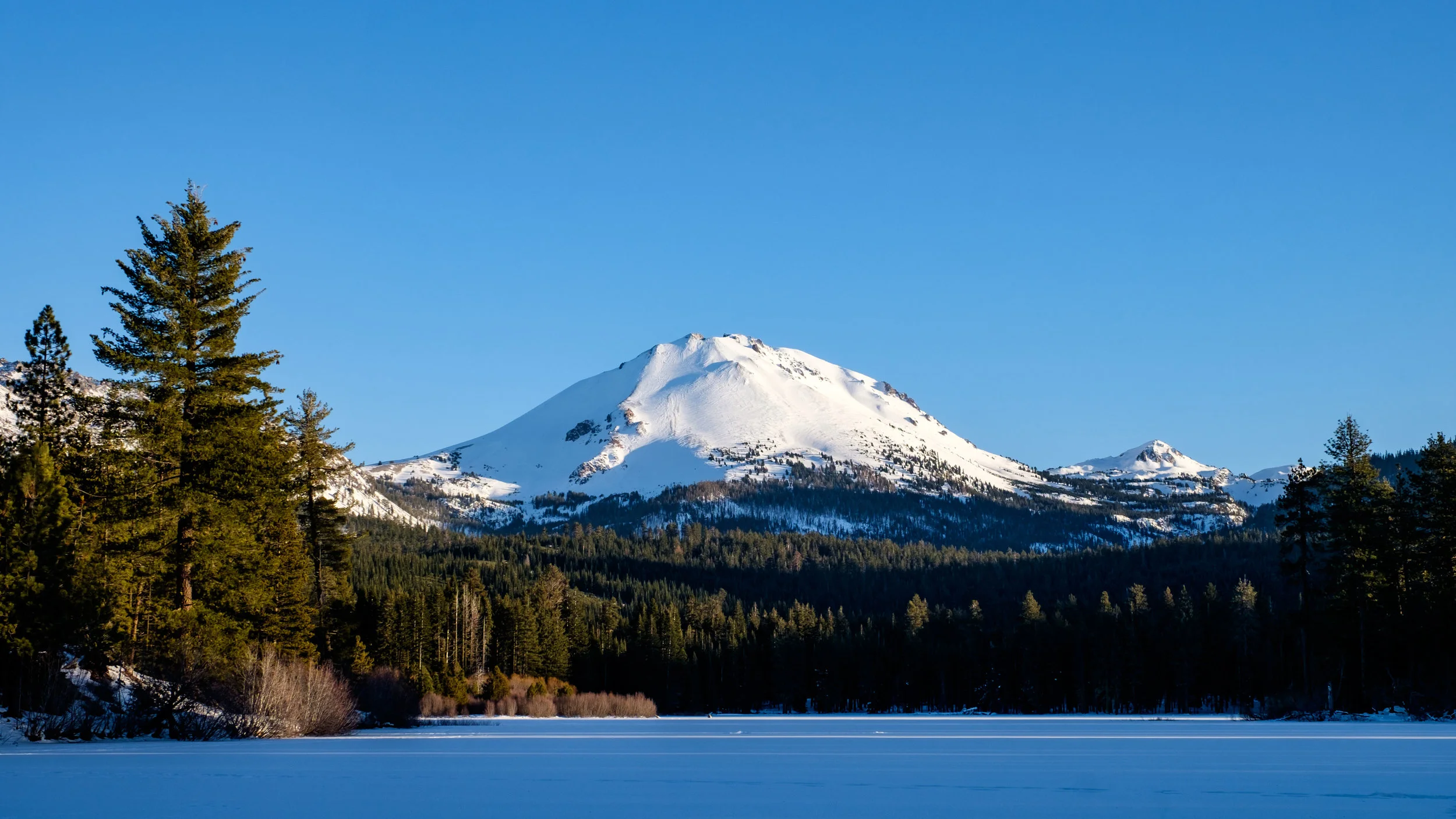 Lassen Peak from the north side of Manzanita Lake during the winter of the National Park Service centennial in 2016. 