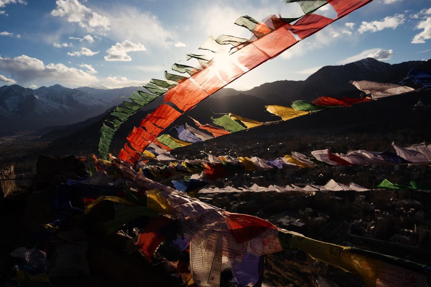 I was hypnotized by the sound of these prayer flags moving with the wind as the last ray of sun fell into the Himalayas &hellip; perched on the edge of a holy temple drinking tea and taking it in. It was absolutely beautiful. The five traditional col