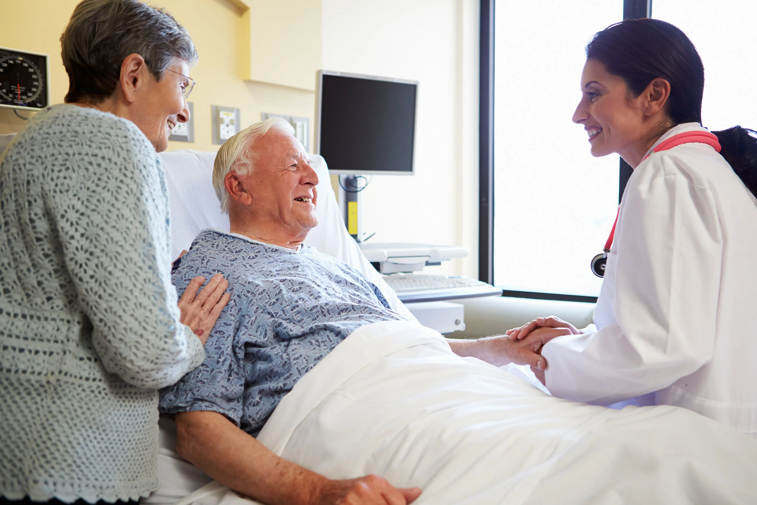bigstock-Female-Doctor-Talking-To-Senio-55984178.jpg
