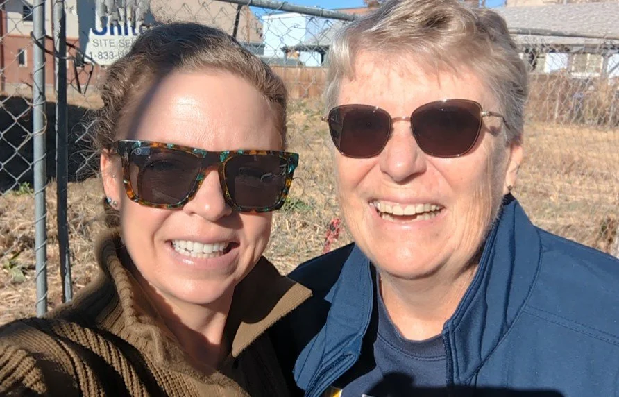 Morgan and a client smile together in the sunshine. Happy!