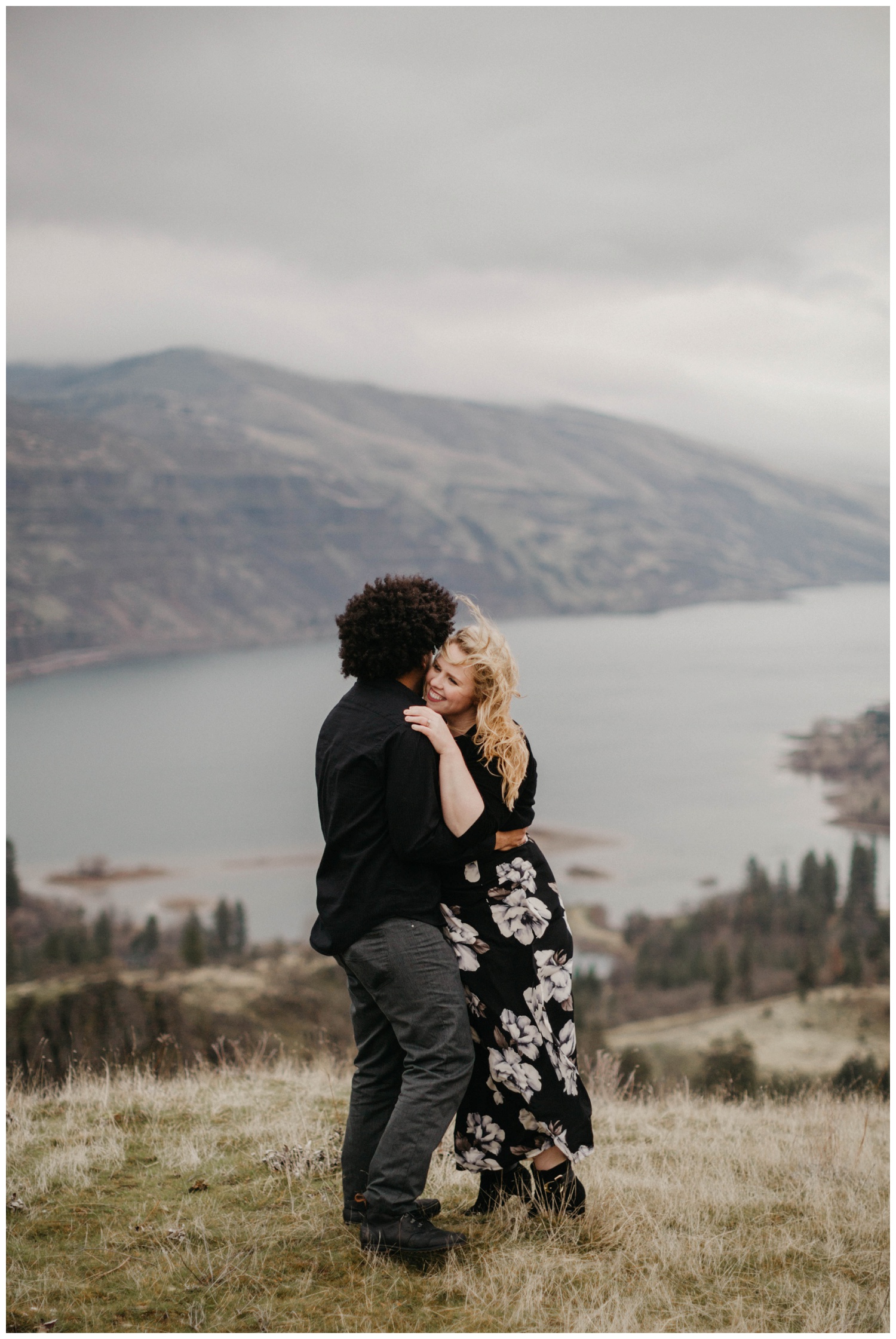 Couple hugging at the top of a hill near Rowena Crest.