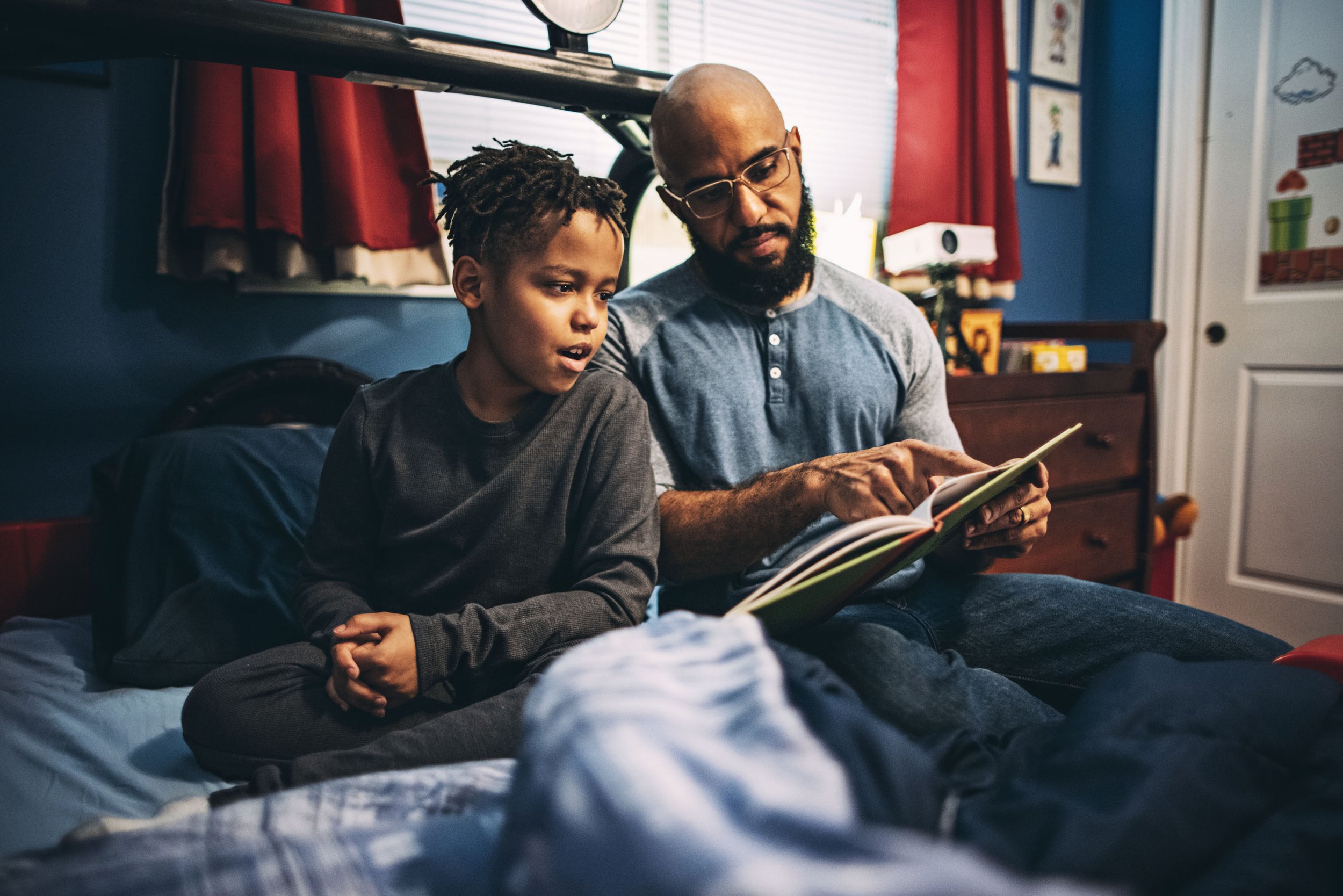 2020_11_08_Allstate father son in bed reading book Clayton Hauck 3967.jpg