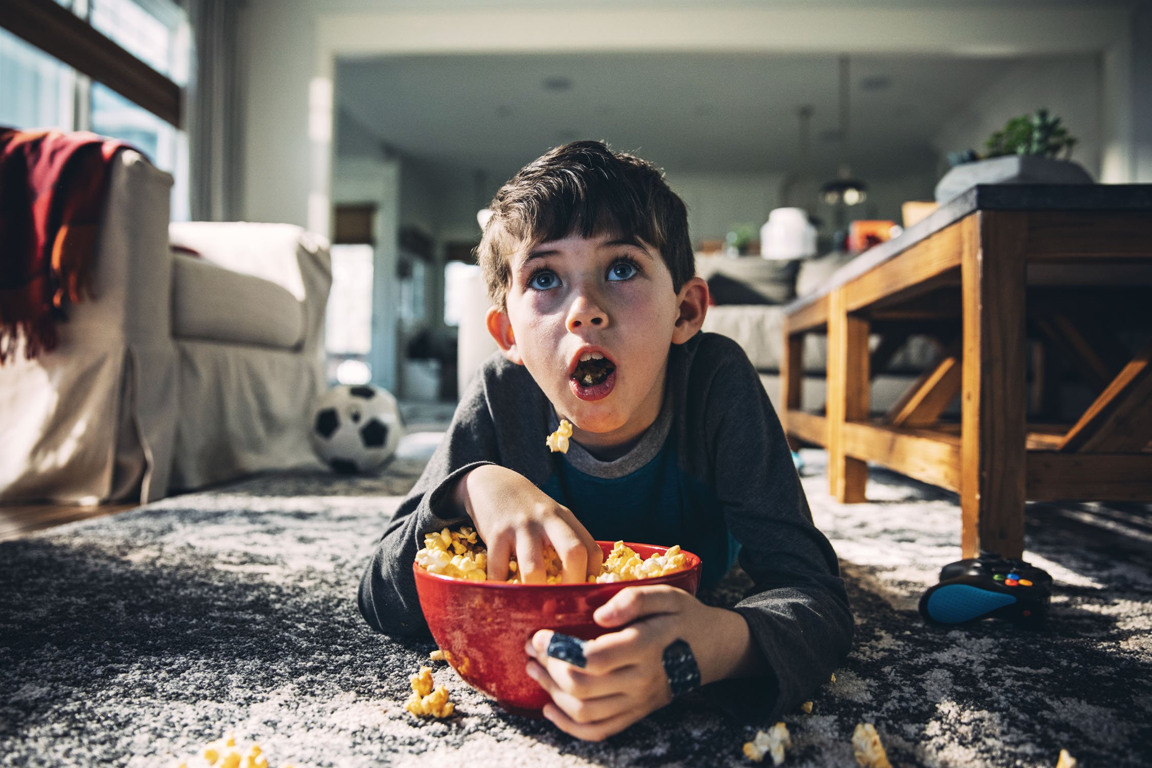 2019_03_27_Orville kid eating popcorn watching tv Clayton Hauck X2A7662.jpg