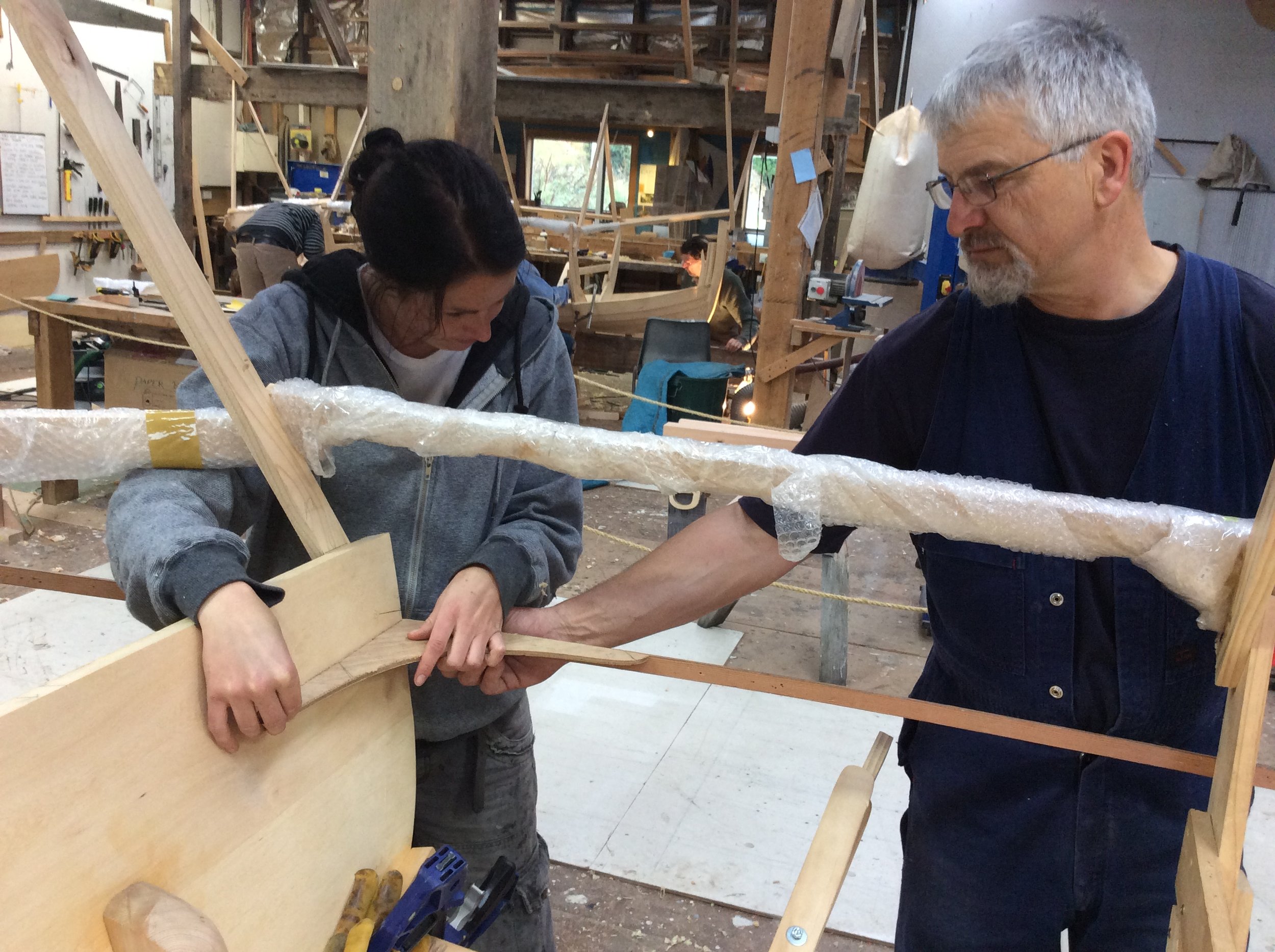 Instructor Mike Johnson with student Ellie preparing for planking.