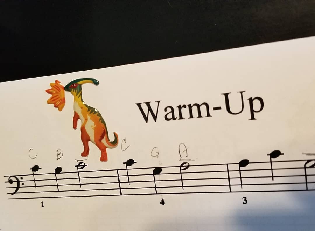 My student was definitely trying to tell a story with the placement of her stickers.  #funtimesatpiano #funwithstickers #pianolesson #stickers #dinosaurs