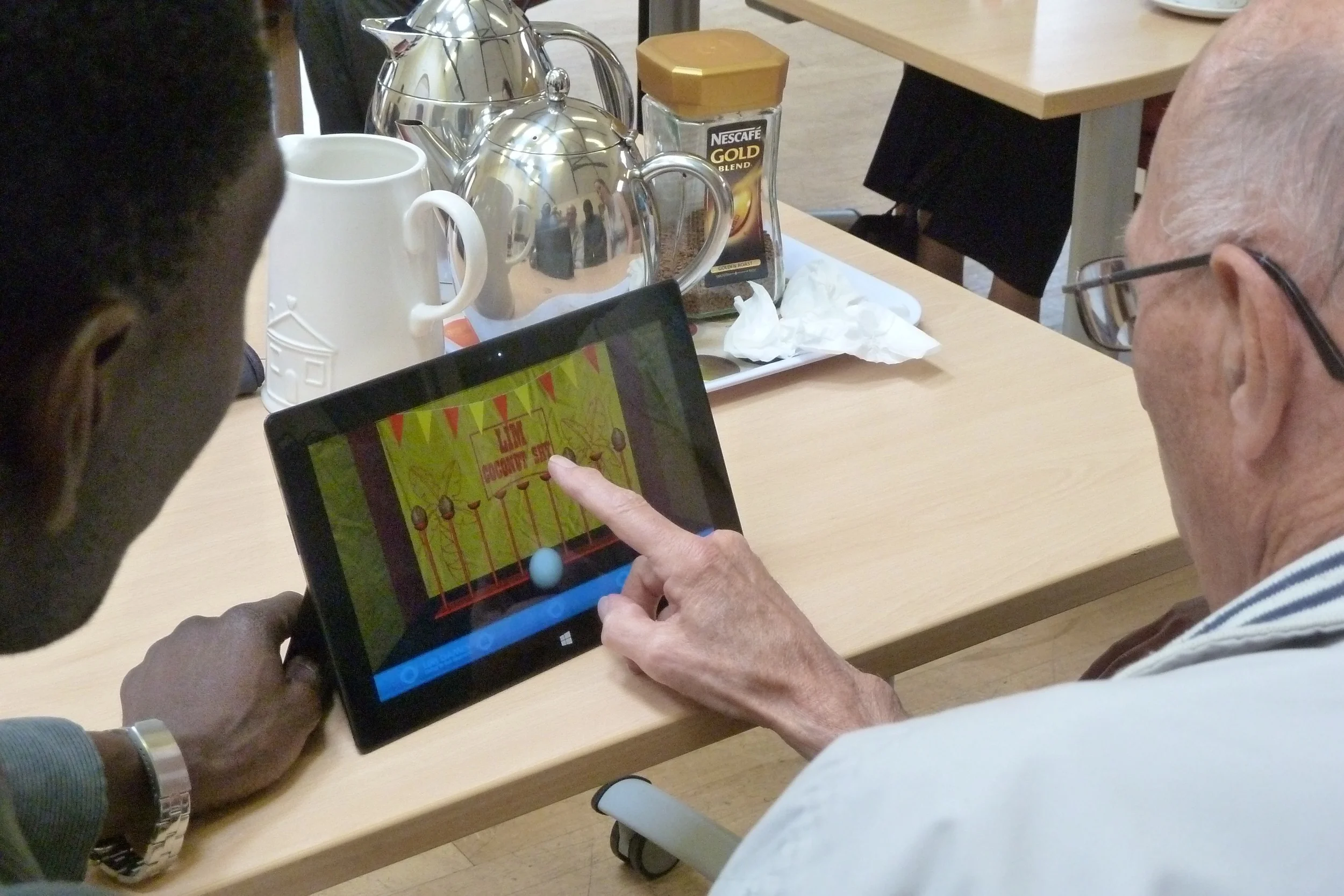 Participants engaging with touchscreen activities (3)