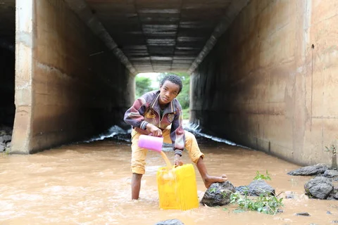 WaterAid, Ethiopia Oromia, Gobena collecting water from the river - Behailu Shefieraw