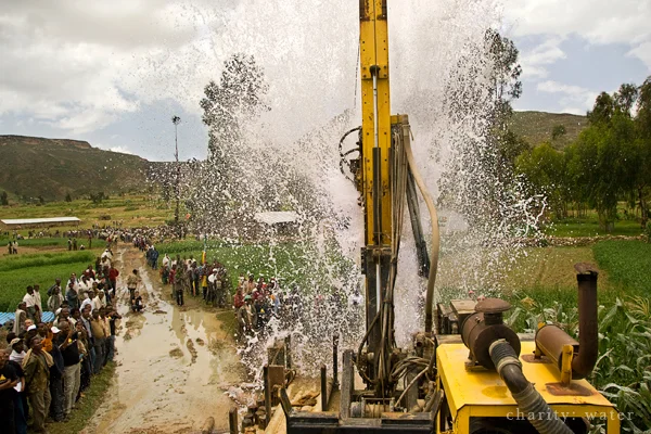 Drilling team accessing water deep beneath the surface. Photo: charity: water