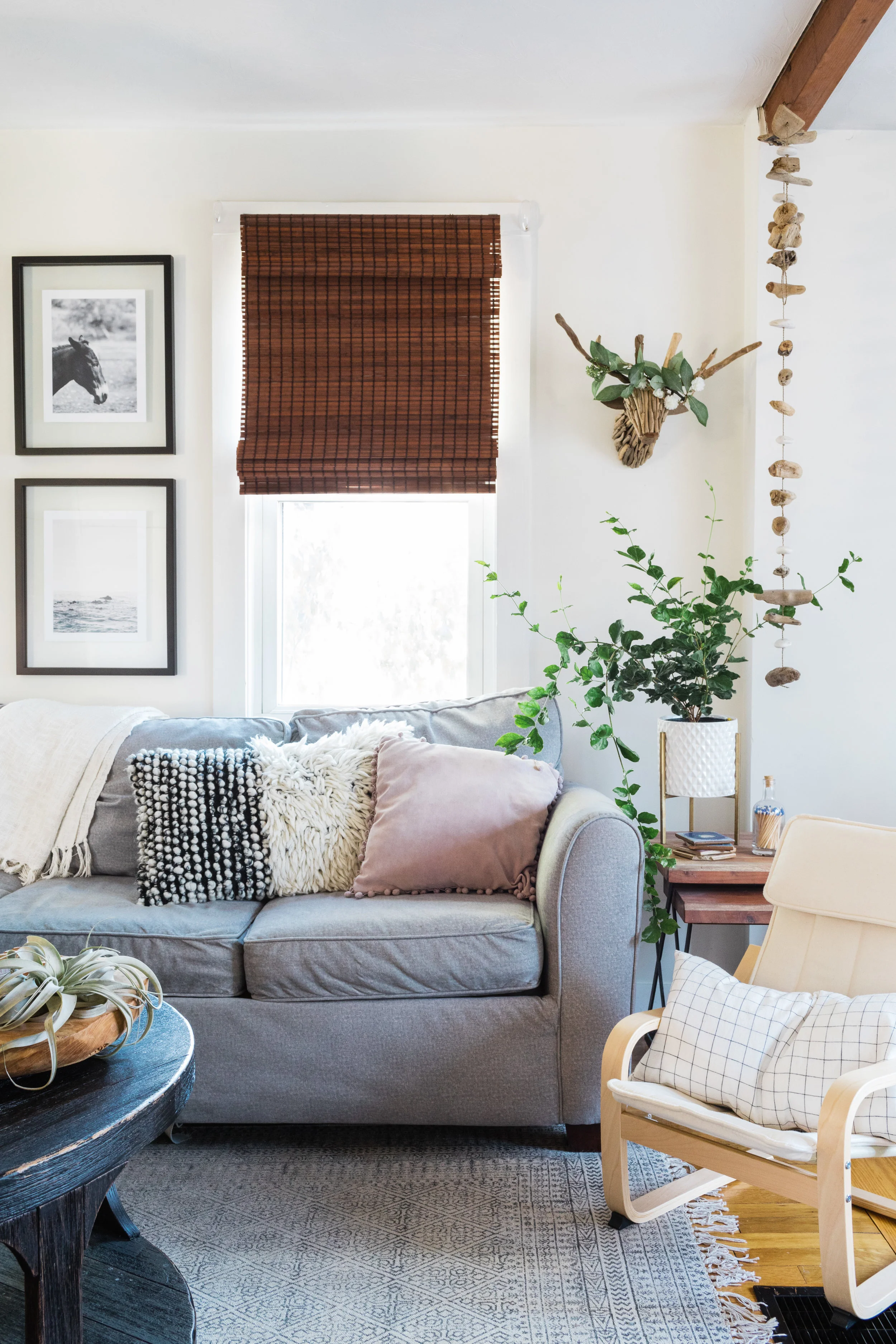 coffee table / children's chair / windowpane pillow / rug / driftwood stag { similar } / driftwood garland { similar }