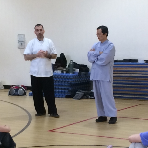 Dr. McCann translating for and assisting his Shifu, Wang Fengming, during a Taijiquan and Qigong seminar (Vermont, 2016).