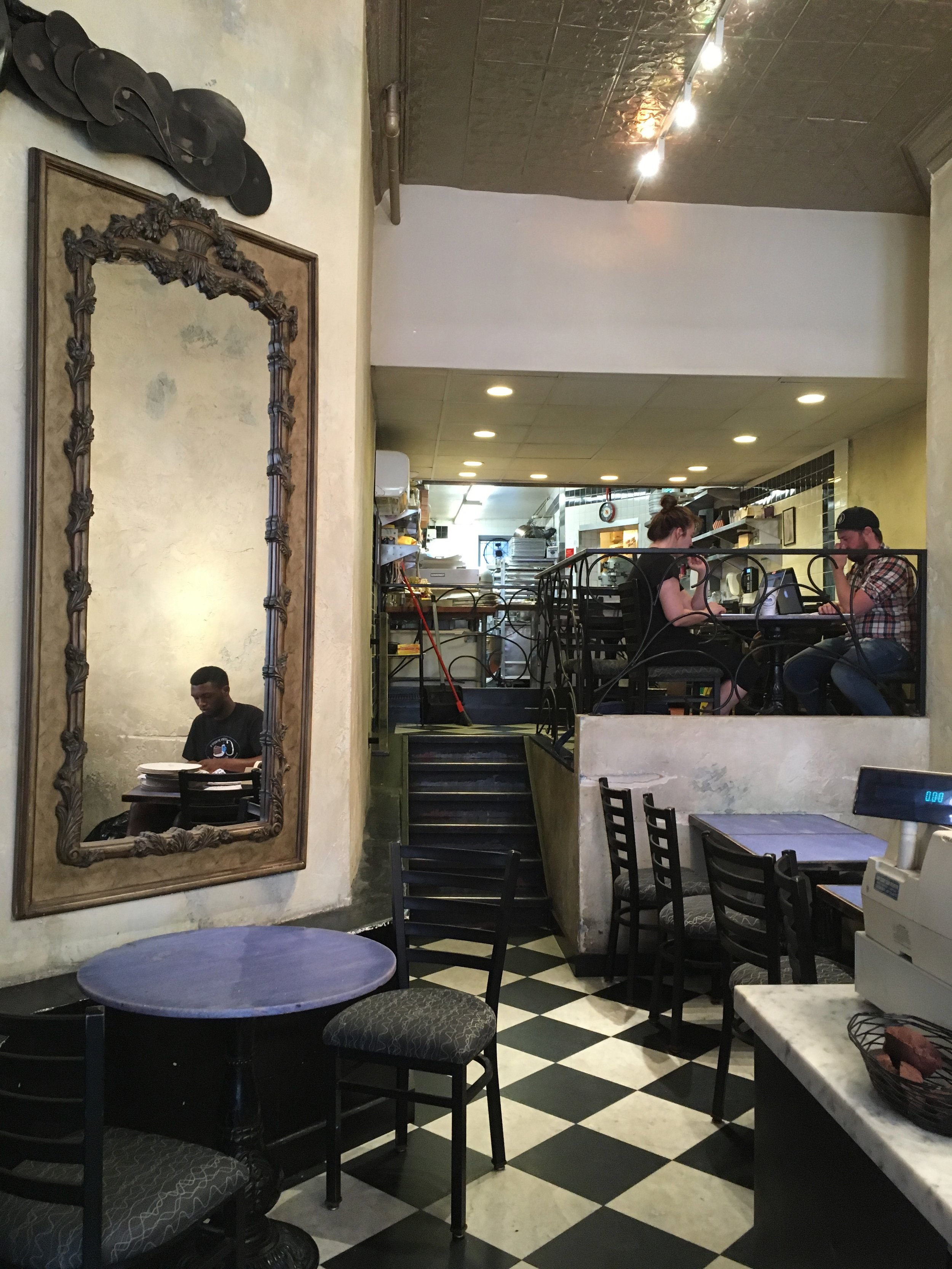 Pressed tin ceiling and periwinkle tables