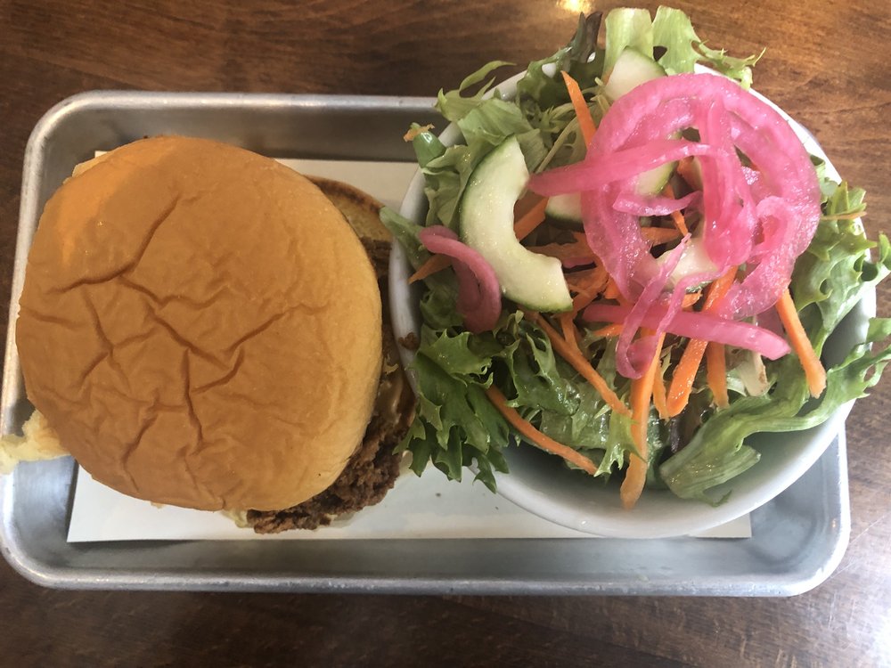 Fried chicken sandwich and a side salad