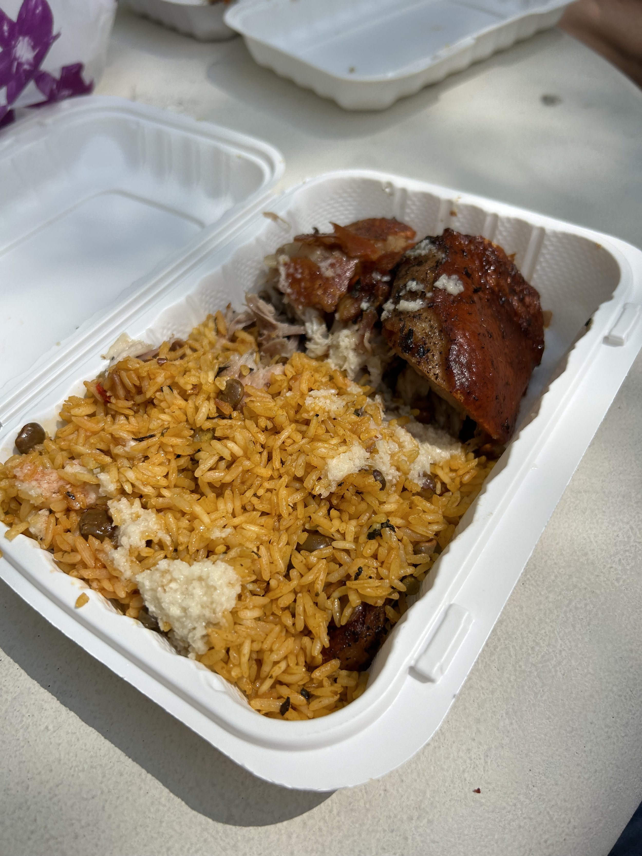 A portion of roast pork, rice and gandules!