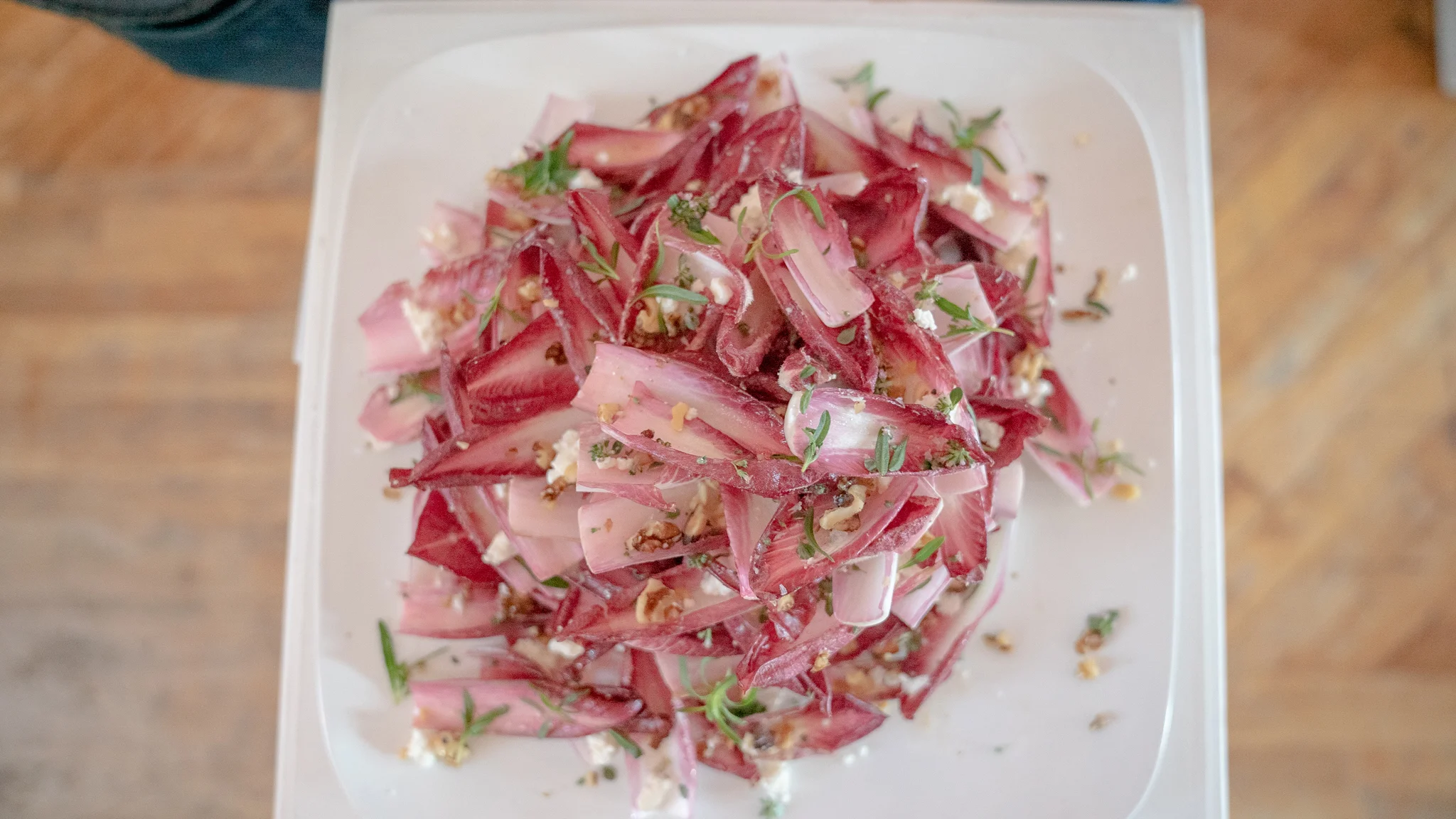 Red endive, marinated feta, walnuts, summer savory. Photo courtesy of Wild Dogs International.