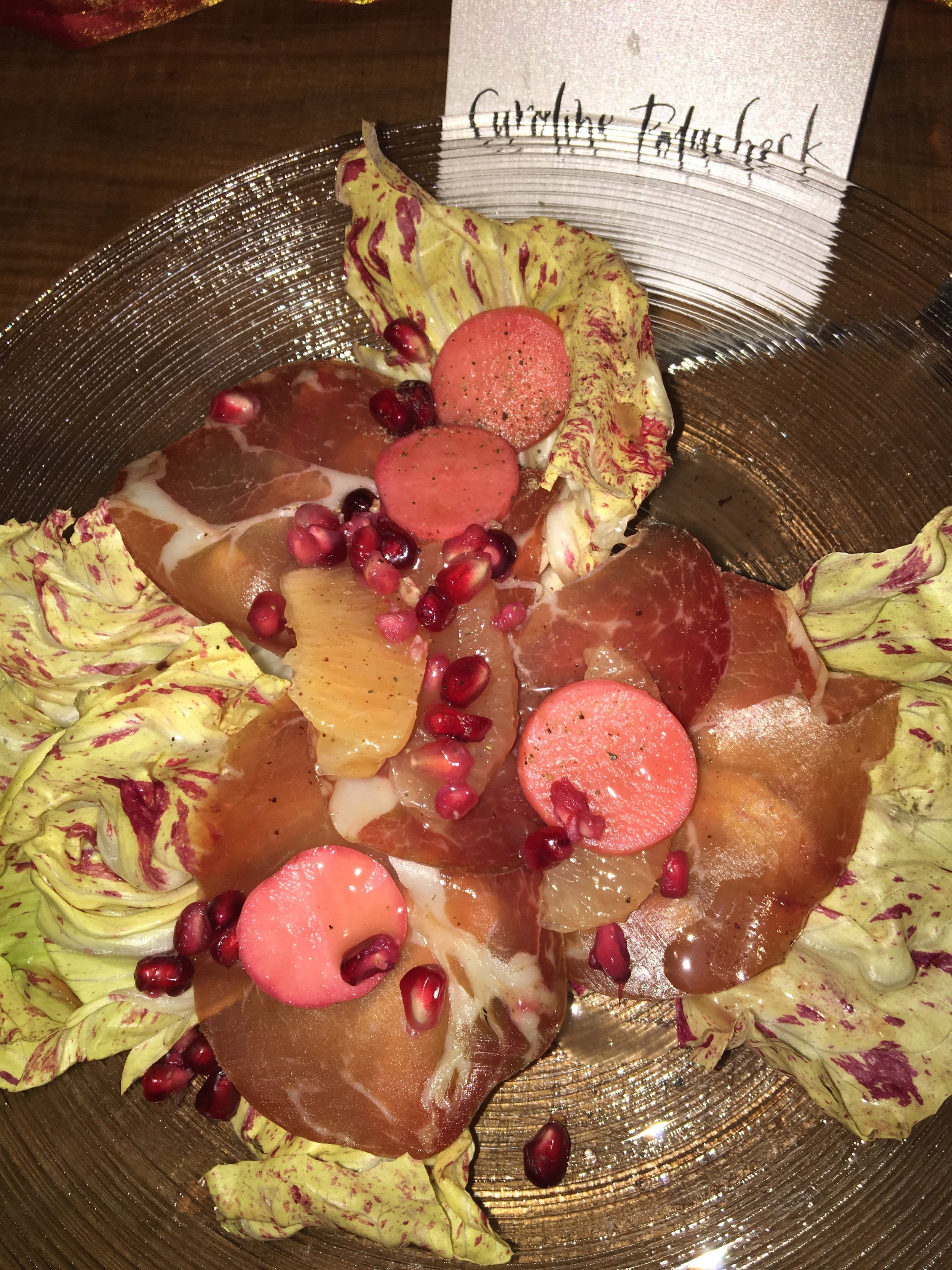  Castelfranco radicchio, sweet coppa, pickled radish, pink grapefruit, pomegranate and brown butter vinaigrette salad for “Coral Blossom” dinner at NeueHouse in collaboration with Farfetch. 