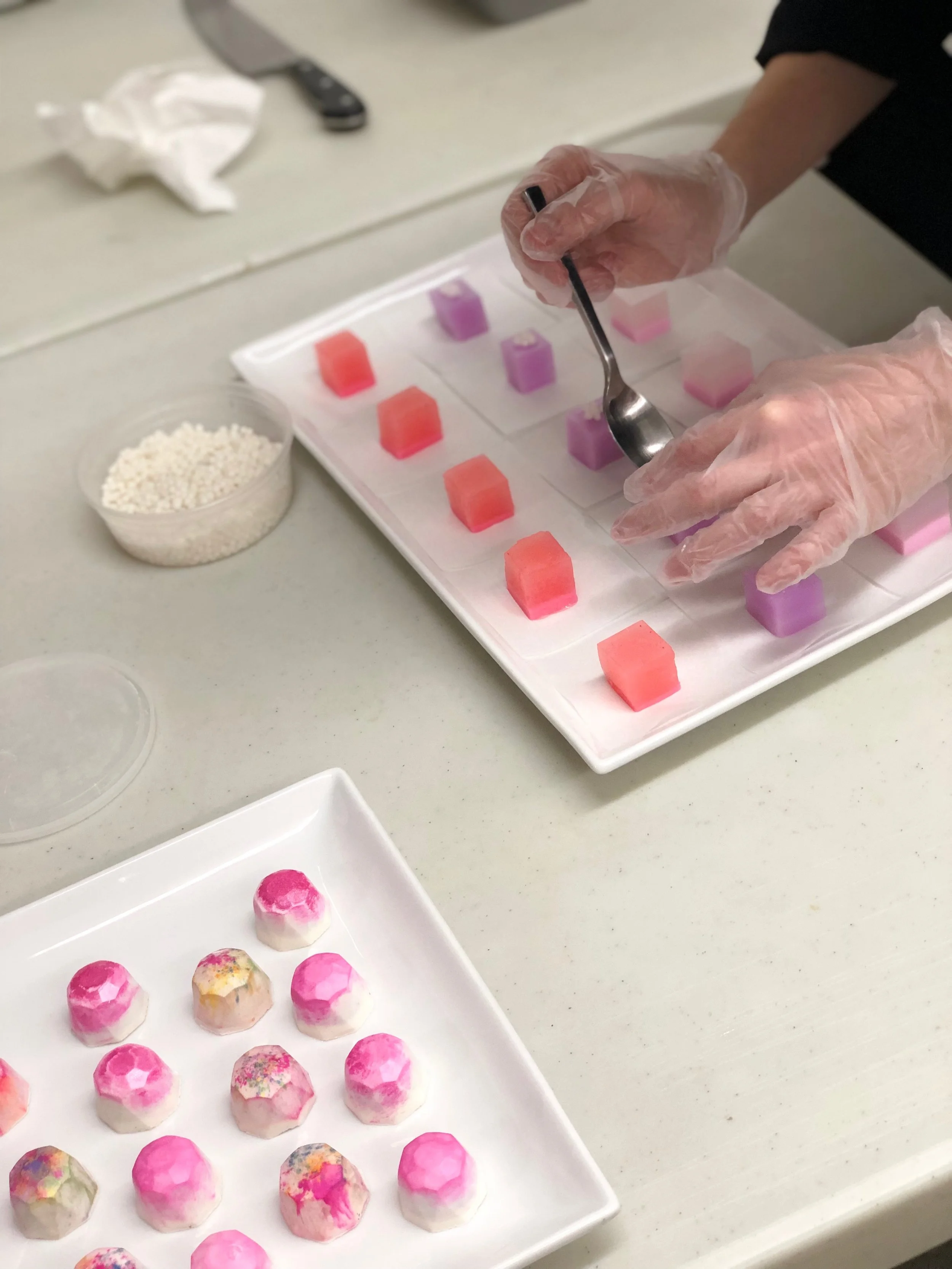  Cosmetics-inspired shimmery agar jelly squares in rose, blackberry, and grapefruit for Bobbi Brown event at Mansur Gavriel. Photo by Coral Lee. 