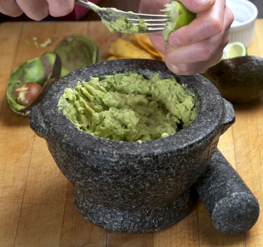 To make guacamole, mash a ripe avocado or two. Add lime juice and sea salt to taste. Optional embellishments include chopped tomatoes, scallions, cilantro, or finely-diced chile peppers. © Photo courtesy of: DTR@Ruhlman.com