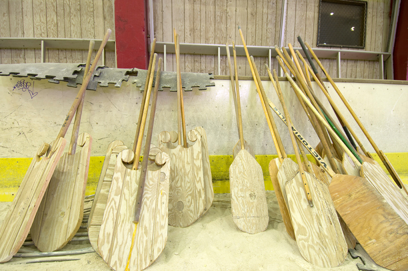  Oars made from wood paneling and old hockey sticks. 