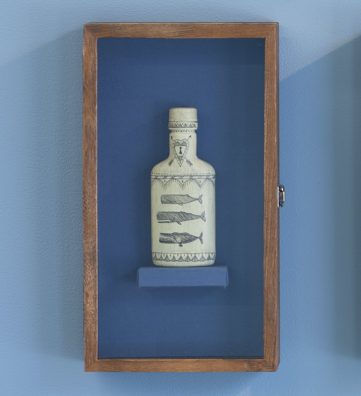   No. 154 of the Poly S. Tyrene Memorial Maritime Museum , 2020, Reclaimed ocean plastic, ink, wax in wood &amp; glass case, 14.88” x 8.5” x 2.75". Photo courtesy of Will Howcroft for Praise Shadows Art Gallery. 