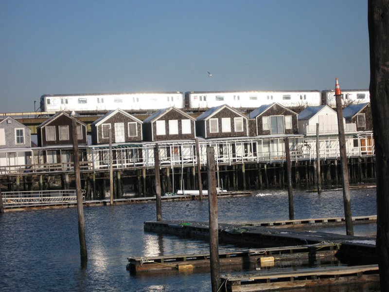  First thing I noticed from the A train was an old pier of row houses on stilts. 