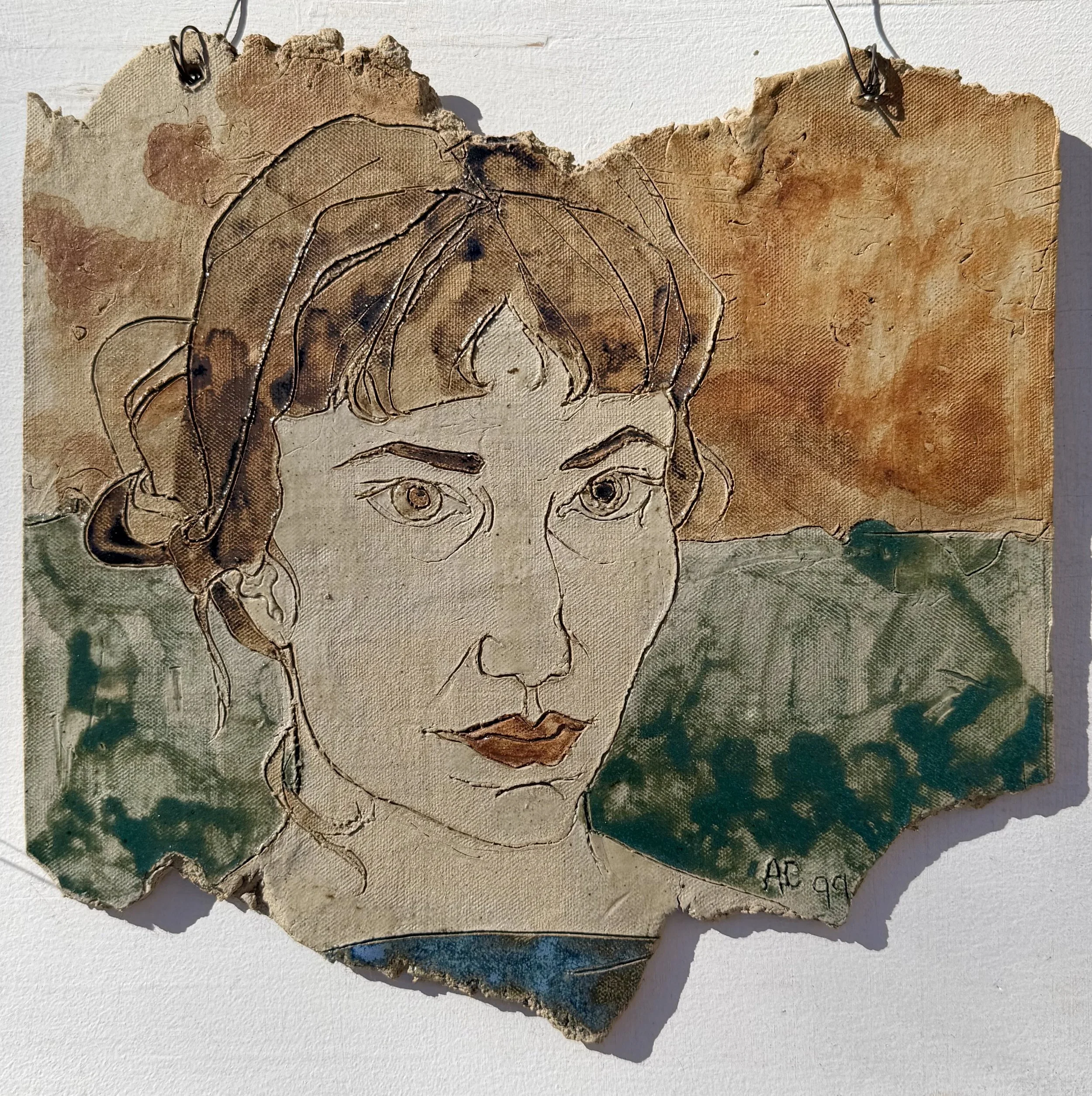   Self-portrait in the shape of Ohio.  1999. Fired and glaze earthenware tile, approx. 12” x 12.” 