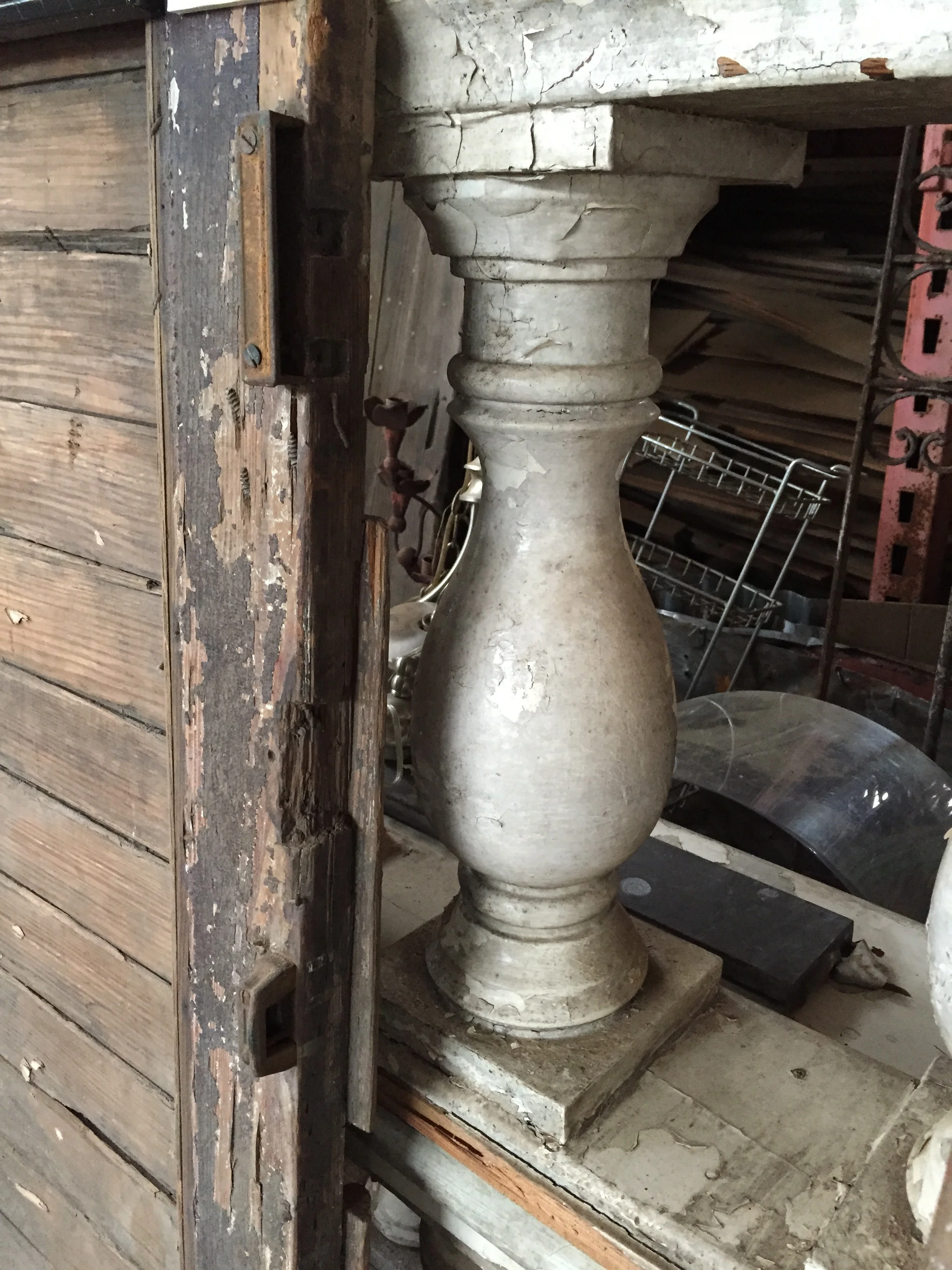 The baluster in our shop, before removing it from balustrade and rail. You can see the palimpsest of layers of paint. 