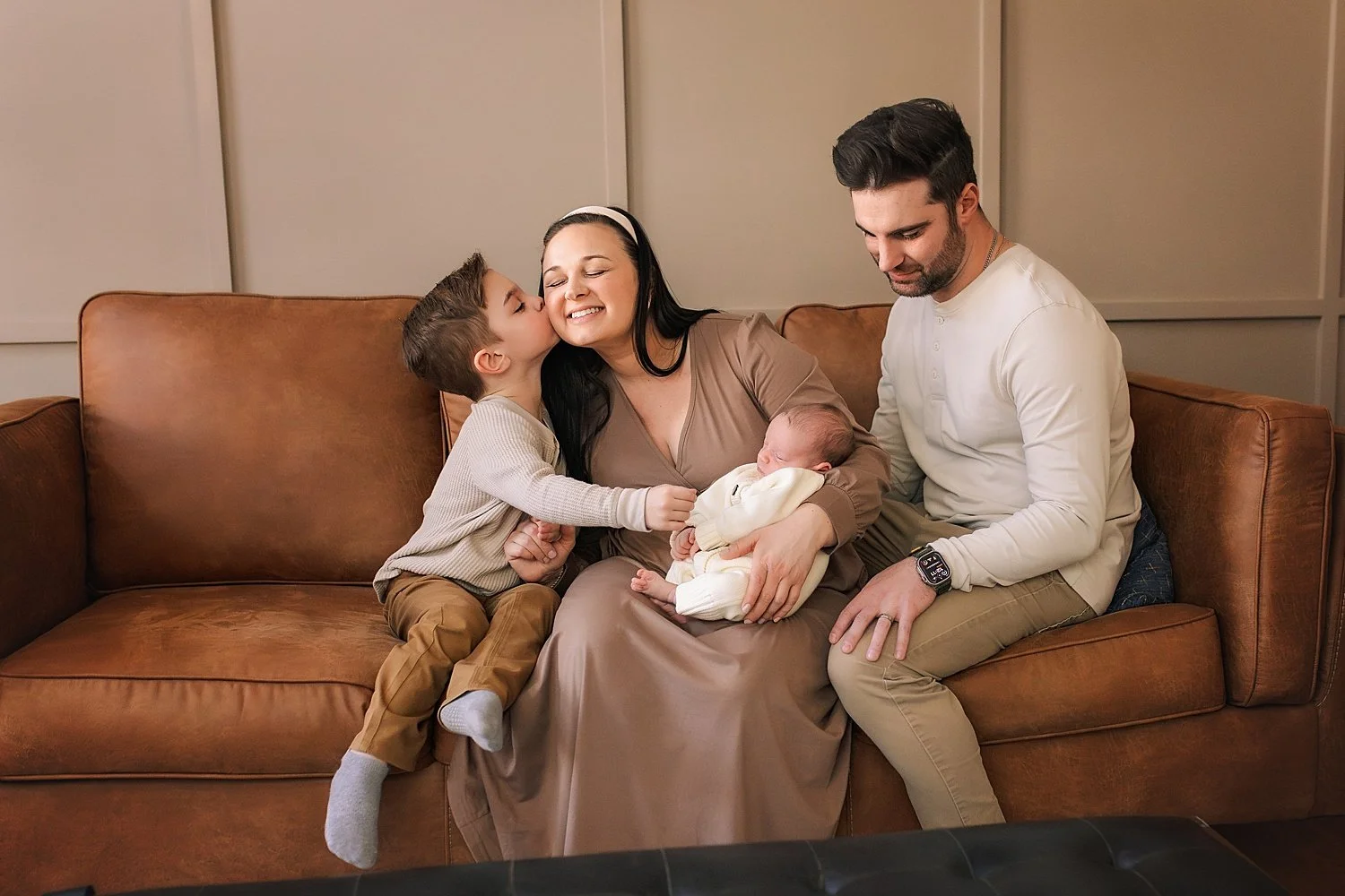 Photographer capturing newborn portraits in home