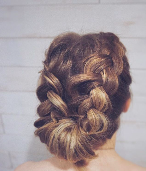Smooth low bun in the back with braids