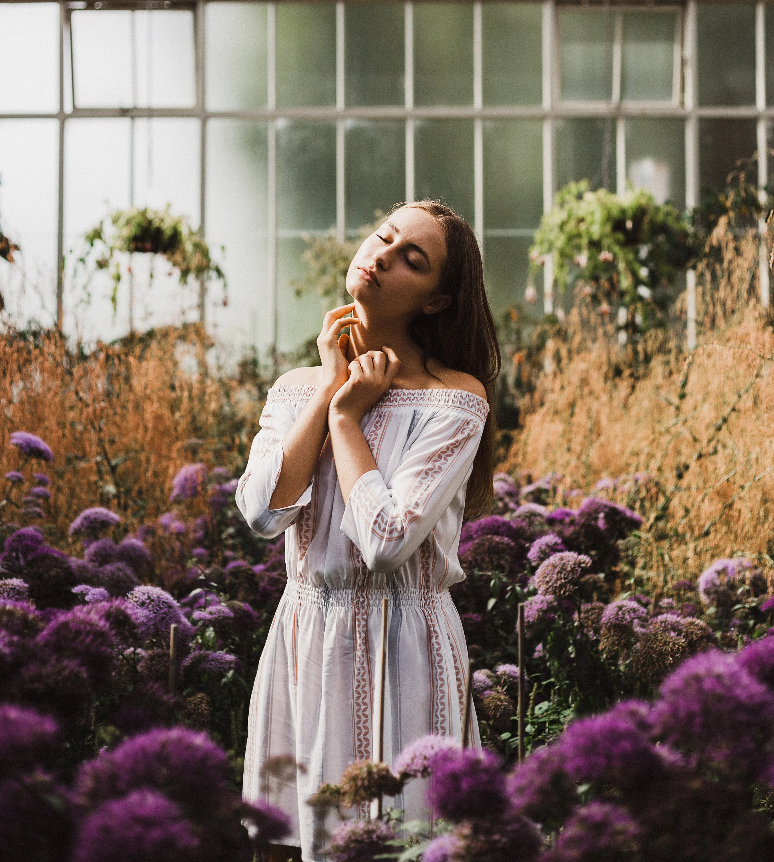 A young woman in a field of purple and lavender flowers