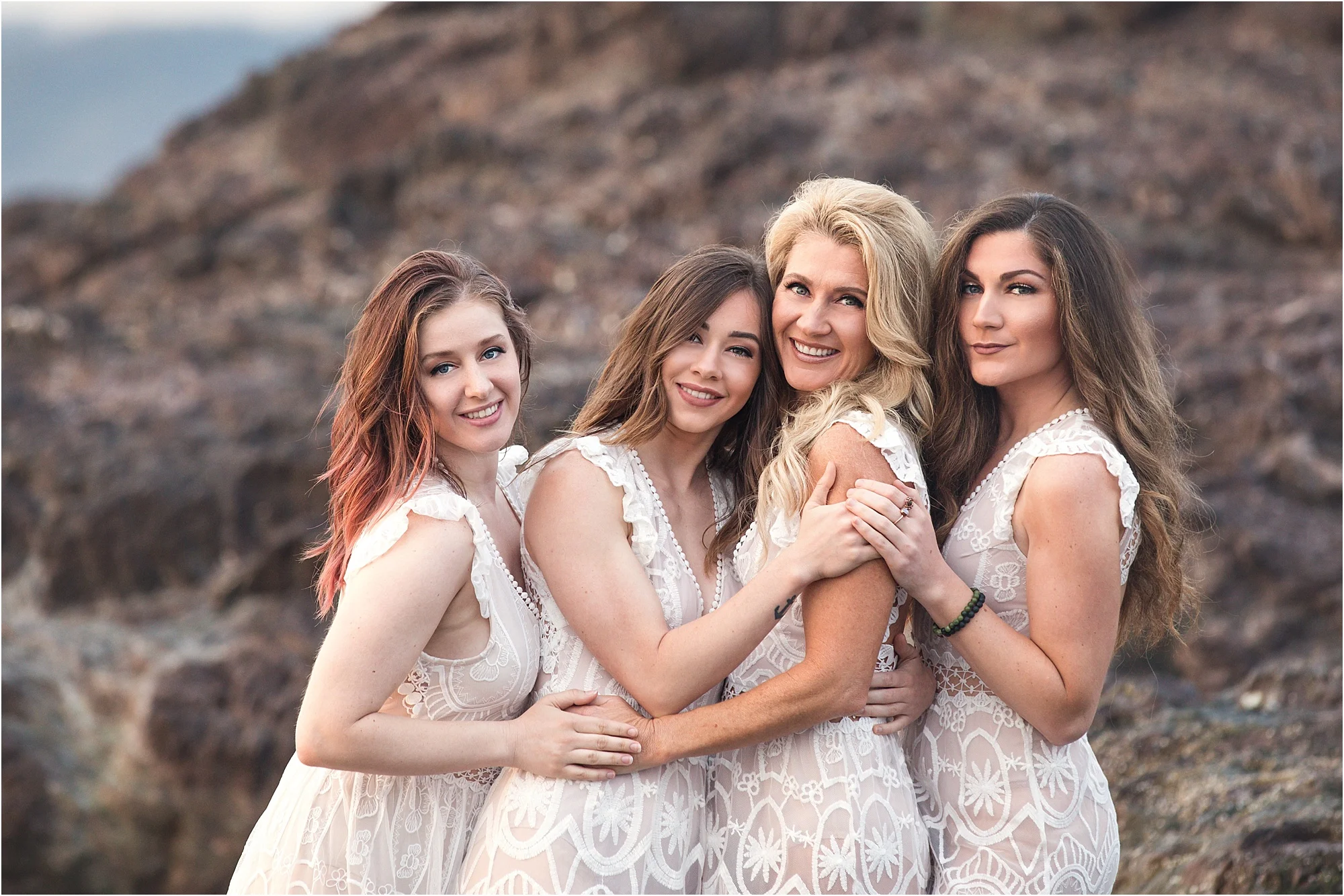 mother and daughters on the beach