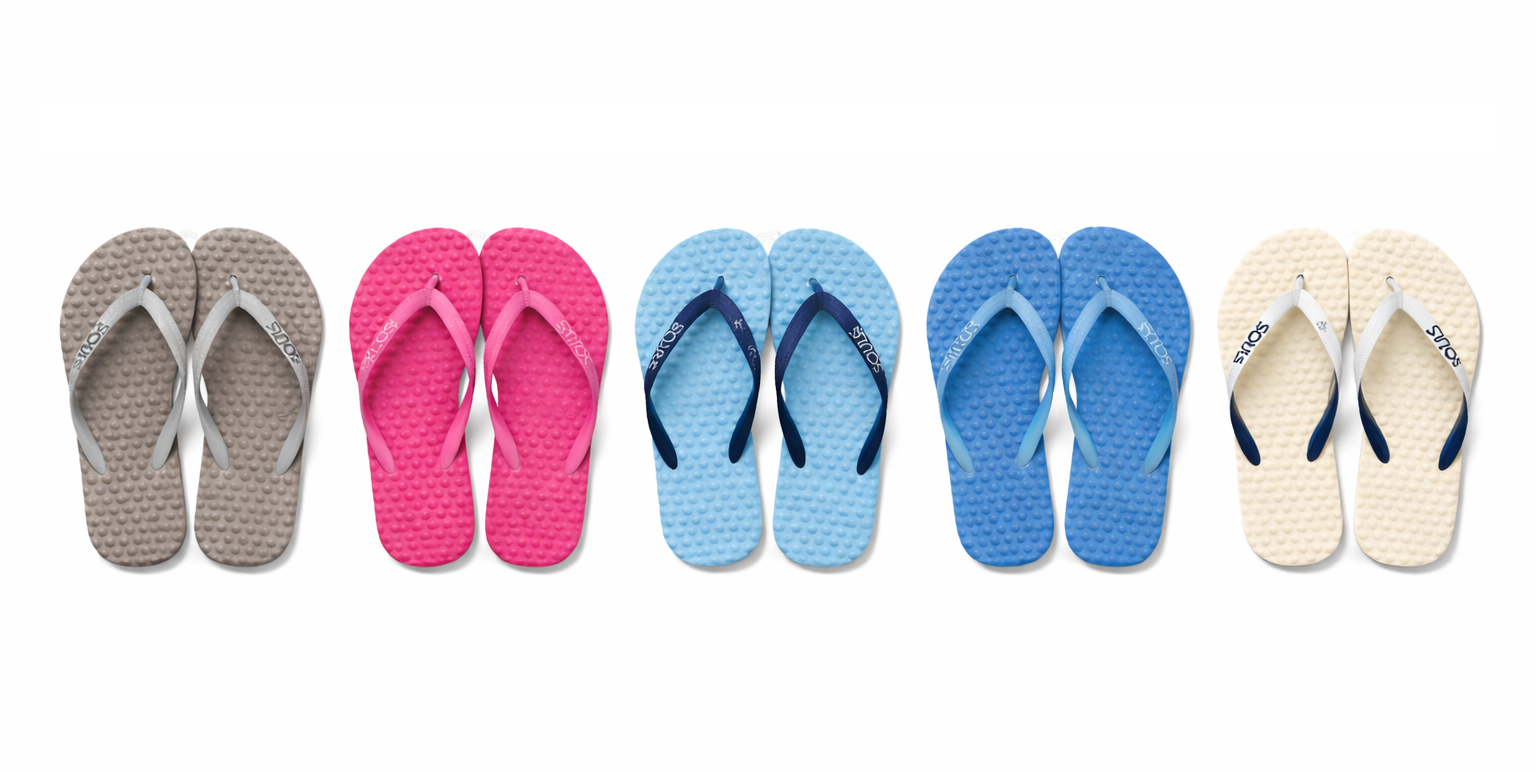 Five pairs of colorful flip-flops arranged in a row on a white background.