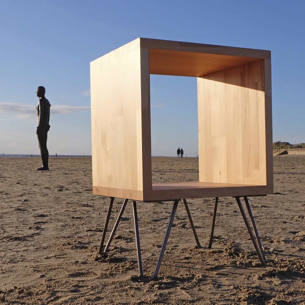 Cubed mono in Beech. On a beach. In 'Another Place' Crosby Beach, Liverpool, UK
