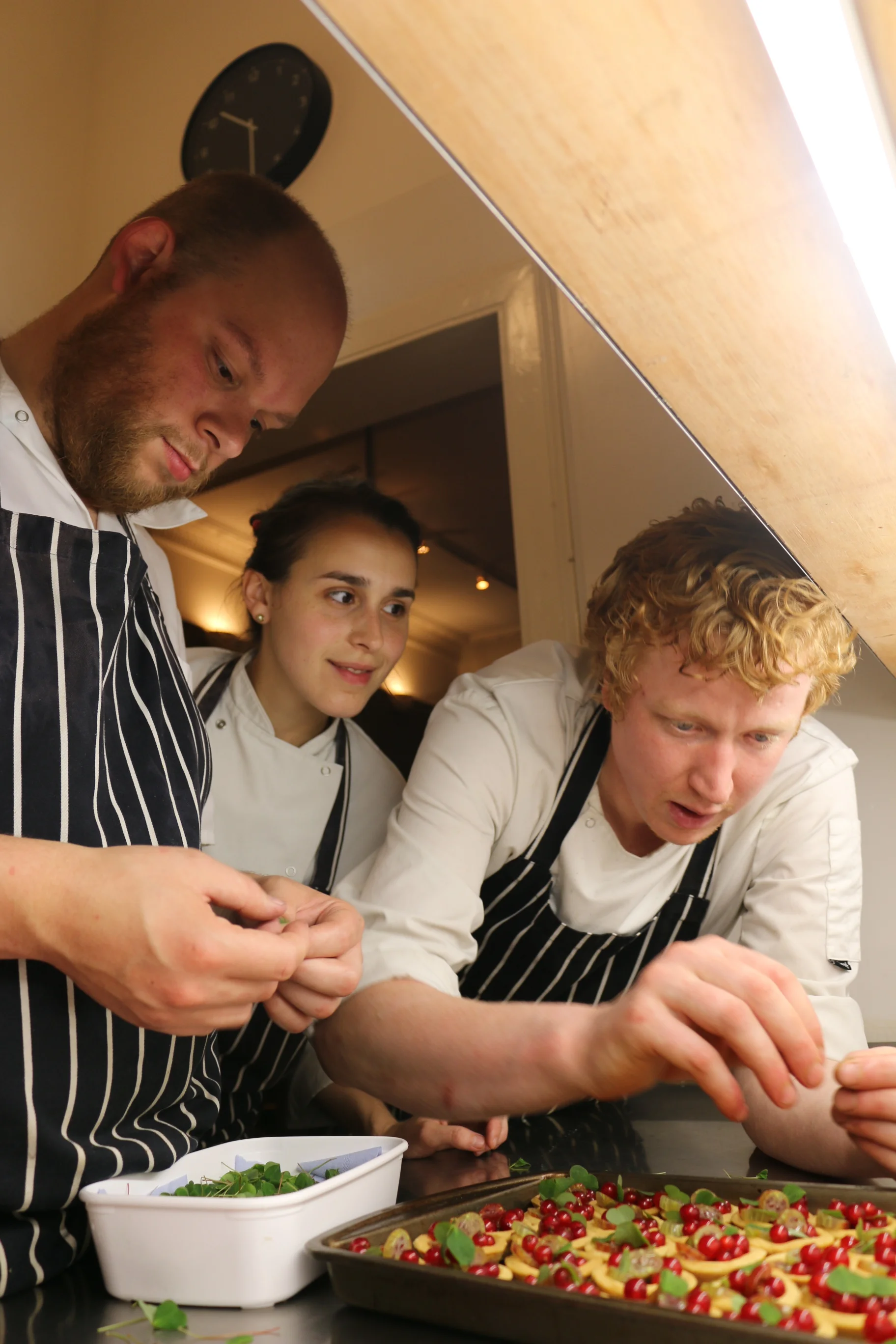 Marnix Borst helps the 'house DJs' Sashana Souza Zanella and Ben Reade with a tartlet 