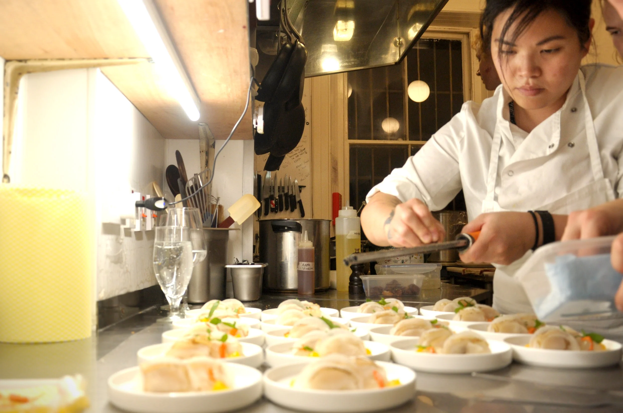 Emily Waldon Harris, Sous Chef to Ana Ros finalises a scallop dish