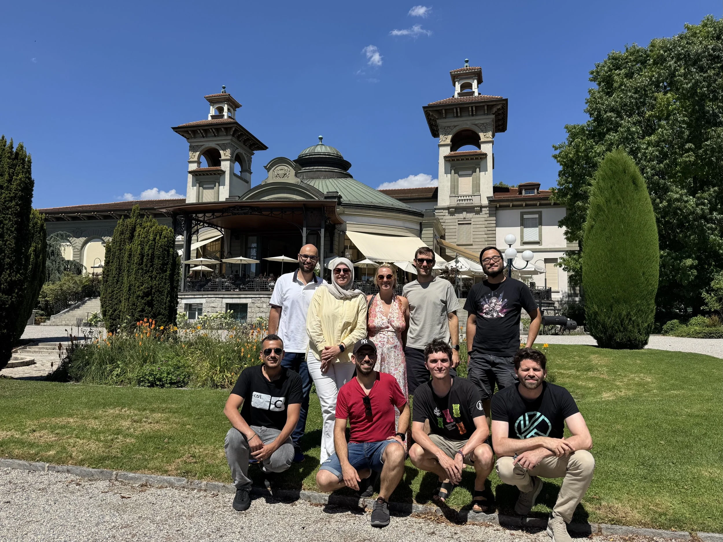 The nine-person PocketCampus team in front of the Casino de Montbenon in Lausanne on a sunny summer day