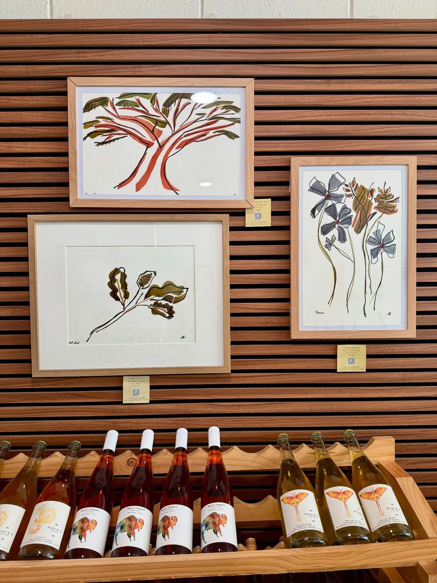 We&rsquo;re so excited to feature the work of Jenna Hutton @jenna.l.hutton behind the bar at the tasting room! ✨ Jenna creates with watercolor and ink pen, sometimes even crafting her own paints from natural resources like soil and spices. Her art is