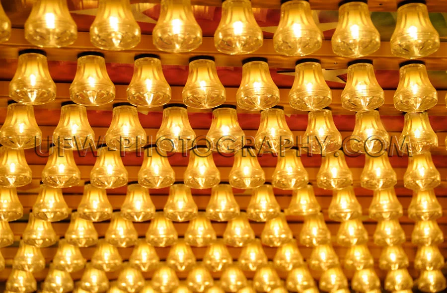 Rows small glowing light bulbs amusement park Stock Image