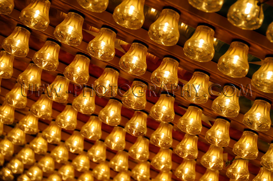 Diagonal pattern rows golden glowing small light bulbs Stock Ima