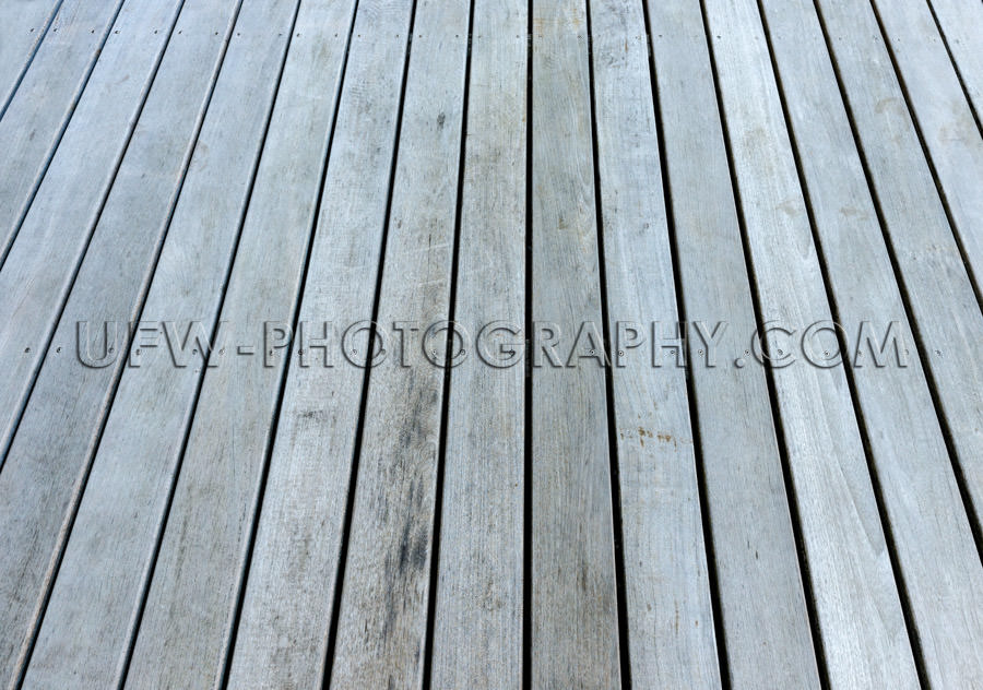 Gray weathered wood patio floor full frame plank background XXL 