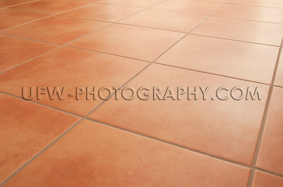 Terracotta floor tiles clean background diminishing perspective 