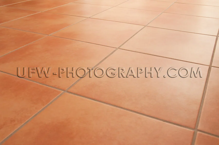Terracotta floor tiles clean background diminishing perspective