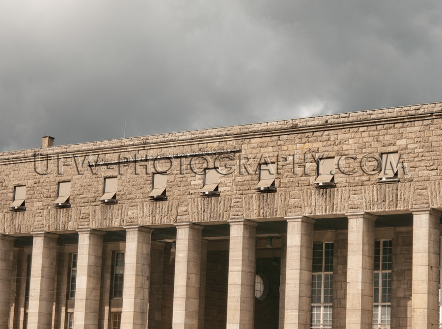 Classic limestone building under gray clouds Stuttgart railroad-