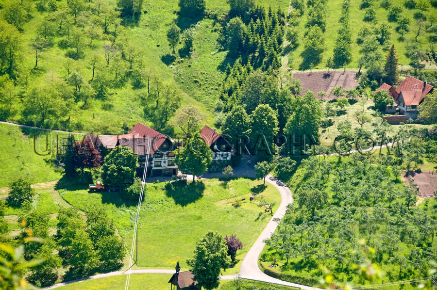 Aerial view beautiful Black Forest valley farm trees meadows Sto