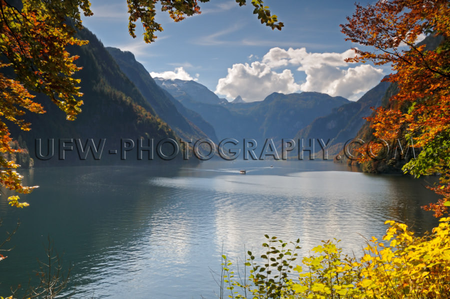 Idyllic mountain lake autumn colors framed by leaves Stock Image