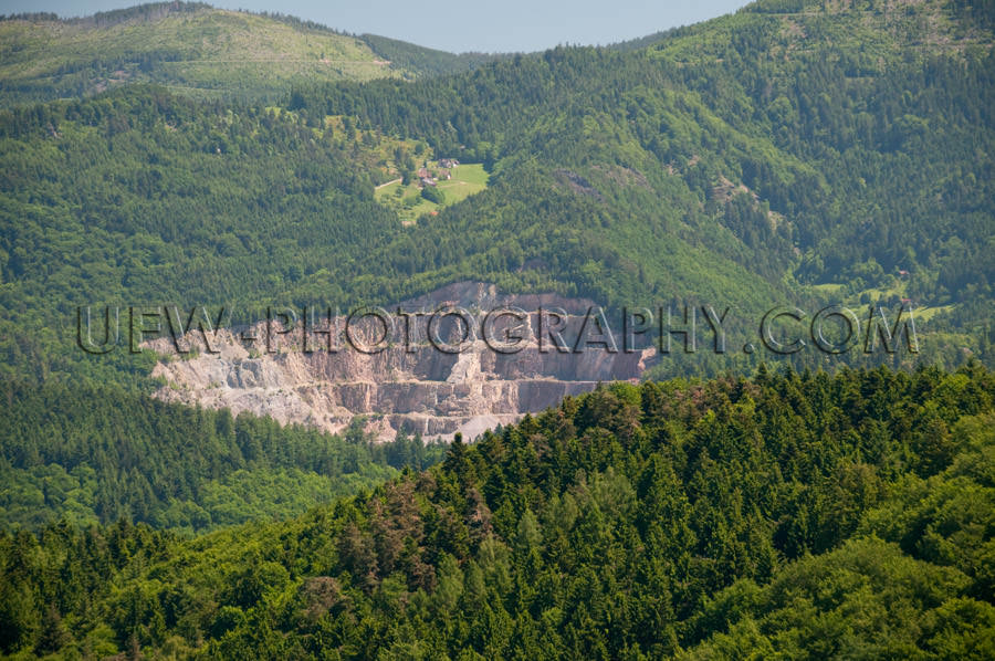 Quarry in a beautiful hilly forest landscape Stock Image