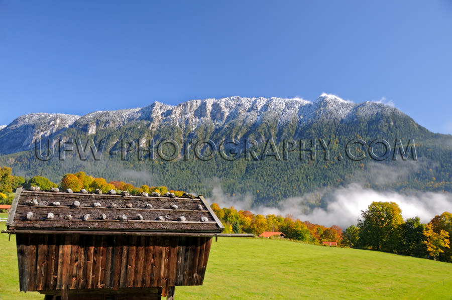 Scenic snow powdered mountain ridge, a landscape in autumn color
