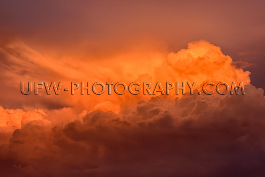 Awesome orange red dramatic cloud-scape towering dramatic sunset